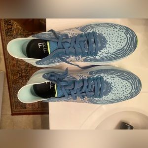 Women’s New Balance Fresh Foam 1080. Aqua and teal. Never worn.